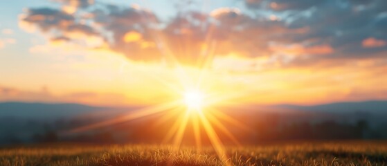 Obraz premium The sun shines brilliantly in the sky, casting long shadows over a green field dotted with trees Mountains loom in the distance