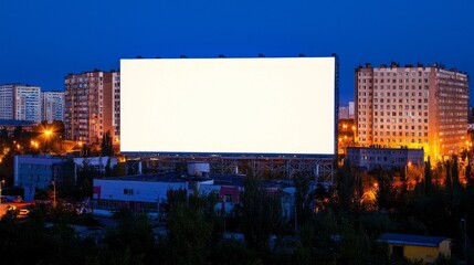 Obraz premium Illuminated Massive Blank Billboard in Urban Area at Night