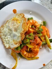 Pad Prik Gaeng Recipe or Thai chili stir-fried menu, a common popular dish for a meal in Thailand the tasted is combination between sweet and spicy with little salty with the Thai herbs smelly