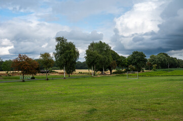 Football field surrounded by meadows and trees at the German countryside in Sittensen, Lower Saxony, Germany