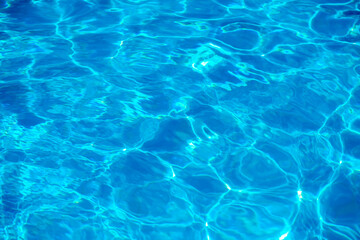 sun glare in the water, water abstract background, clear blue water
