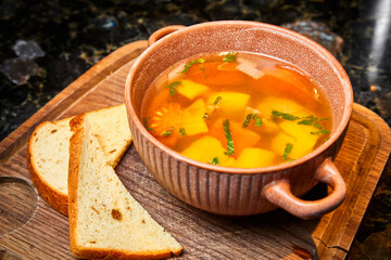 Soup with potatoes and white bread croutons
