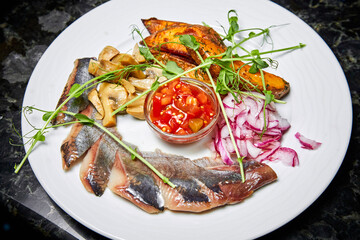 Herring with baked potatoes, pickled mushrooms and sweet onions