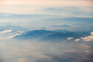 A view of the planet Earth, a view from an airplane, mountains and clouds