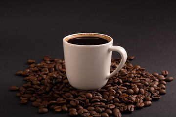 photo coffee beans and a cup of coffee,photography, close-up, shop, coffee, seed, horizontal, bean, drink, background, brown, black coffee, espresso, cafe, caffeine, cup