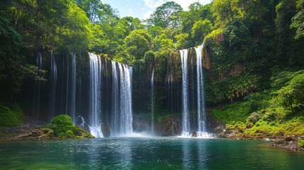 A Majestic Waterfall Cascadng Into a Serene Pool in a Lush Green Forest