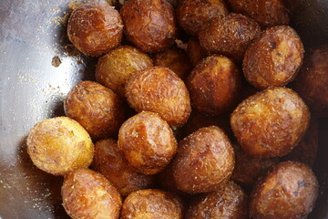 Organic new potatoes fried. Closeup photo of roasted potatoes