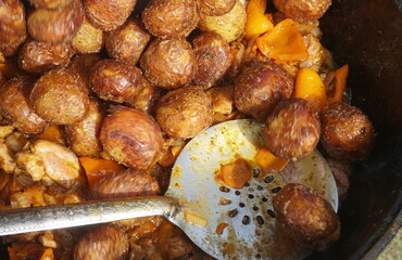 Organic new potatoes fried. Closeup photo of roasted potatoes