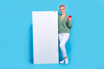 Full length photo of young customer girl pink hair satisfied website digital display hold...
