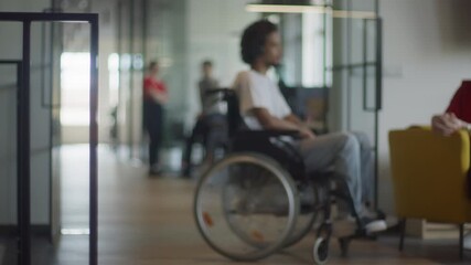 African American businessman in a wheelchair engages in a professional discussion with his colleague, addressing various business challenges and exploring solutions in an inclusive and diverse modern - Powered by Adobe