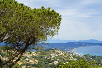 Obraz premium view from the Castell de Begur towards the Mediterranean Sea and the long beach between Pals and L'Estarit, Pyrenees at the horizon, Catalonia, Costa Brava, Girona, Spain