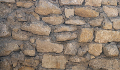 Yellow stone wall close up