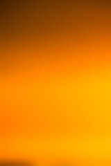 Gradient background: Sunset Symphony: captivating beauty of a golden hour sunset in this vibrant gradient. The seamless transition from deep amber to soft yellow evokes a sense of tranquility and wond