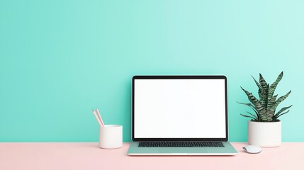 Minimalistic workspace featuring a laptop, plant, and stationery against a vibrant turquoise wall.
