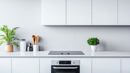 Modern kitchen interior with white cabinets, sleek countertop, potted plants, and minimalist decor, creating a fresh and inviting atmosphere.