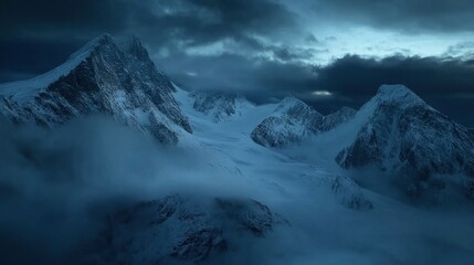 Obraz premium A high-angle shot of snowy mountains covered with clouds during a dark evening , ai