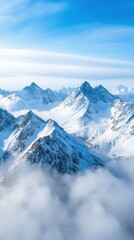 Naklejka premium Aerial of a rugged mountain range with snow-capped peaks and mist rising from the valleys below, creating a dramatic and awe-inspiring scene