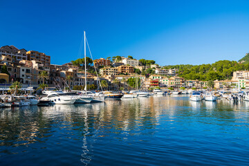 Panoramic beautiful coastal view in  tourist town of Port de Soller. Moored yachts, ships in harbor. Palma Mallorca, Majorca island, Spain Medierranean Sea