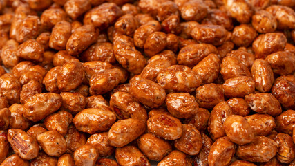 Tasty sweet roasted peanuts as a background.