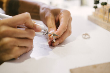 jewelry workshop, ring processing with a drill