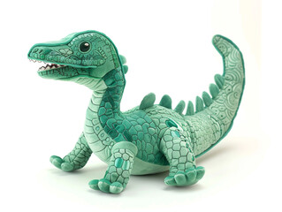 Fototapeta premium A green stuffed dinosaur is laying on its back. The dinosaur has a mouth open and teeth showing