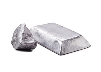 Isolated zinc ingot or bar next to raw zinc nugget on isolated w