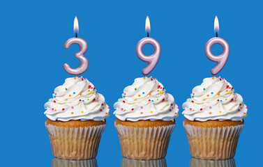 Birthday Cupcakes With Candles Lit Forming The Number 399