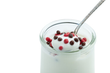 Dessert yogurt with chocolate and berry balls isolated on white