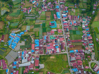 Fototapeta premium Aerial drone view of greenery countryside scenery in Berastagi, North Sumatra, Indonesia. 