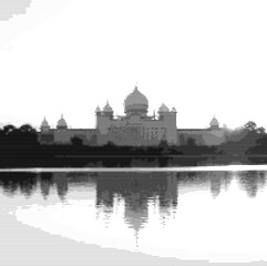 Historic edifice's outline against a setting sun.