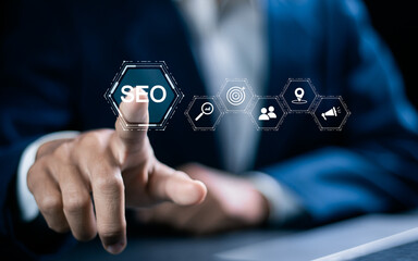 Businessman touching SEO icon on virtual screen for analyze SEO search engine optimization. Promote...