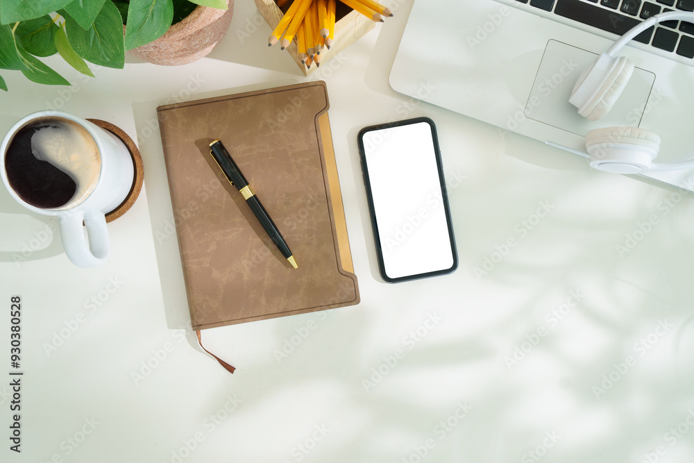 Canvas Prints top view smart phone with empty screen, notebook and coffee cup on wooden office desk. copy space fo