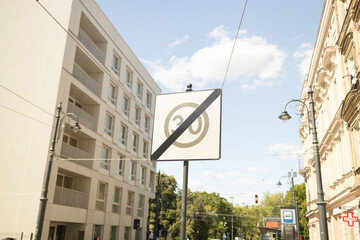  Road signs indicating speed limit and priority road with trees in the background. High quality photo
