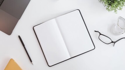 A white desk with an open notebook and a lone pen, highlighting the silent dialogue between creativity and blank spaces.