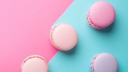 Fototapeta premium Colorful macarons on pink and blue background.