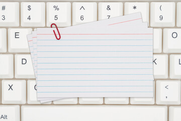  Blank index cards on a keyboard