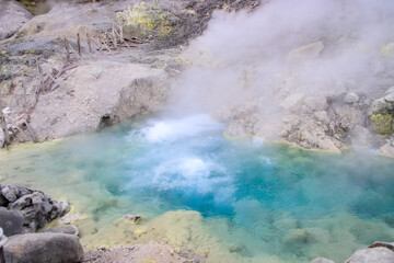 Vibrant Geothermal Pool Amidst Volcanic Terrain in Tamagawa Onsen, Akita, Japan