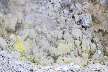 Sulfur Deposits Amidst Steaming Geothermal Landscape in Tamagawa Onsen, Akita, Japan