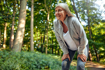 An Exhausted Woman Taking a Welldeserved Break in the Beautiful Nature During Outdoor Exercise