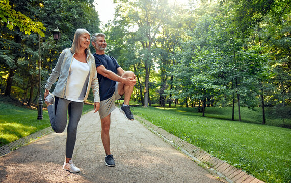 Outdoor Fitness Active Seniors Engaging in Stretching Exercises in Beautiful Nature