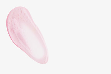 A smear of pink transparent gel on a light background.