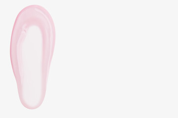 A smear of pink transparent gel on a light background.