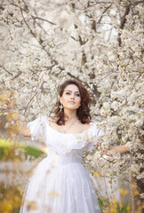 Beautiful bride in blossom garden