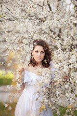 Beautiful bride in blossom garden