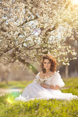 Beautiful bride in blossom garden