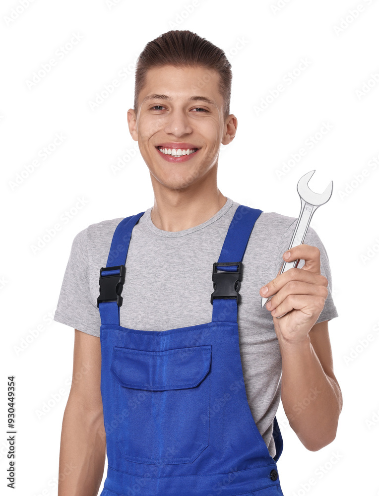 Wall mural Smiling auto mechanic with wrench on white background