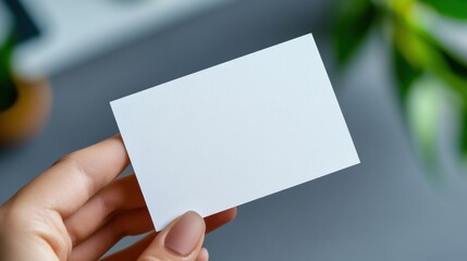 Obraz premium A person holding a blank business card in their hand, AI