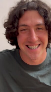 portrait with brakets laughing on camera