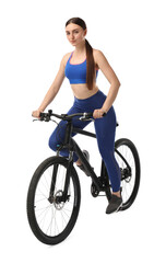 Fototapeta premium Beautiful young woman riding bicycle on white background