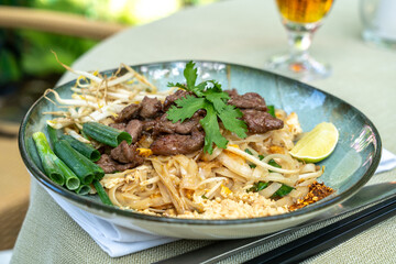 Pad thai,?phat thai, or?phad tha asian noodles, chinese rice pasta with meat in thailand restaurant table